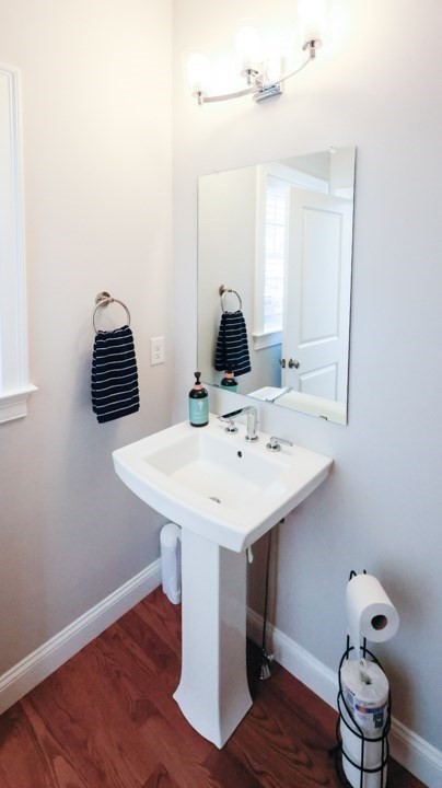 31 Lilac Avenue Bellingham, MA 02019 - Photo 19 of 40 a bathroom with a sink and a mirror