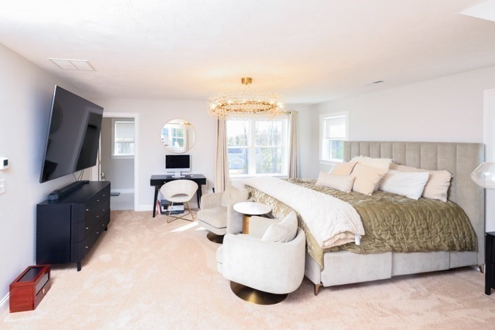 31 Lilac Avenue Bellingham, MA 02019 - Photo 25 of 40 a bedroom with a bed and a flat screen tv