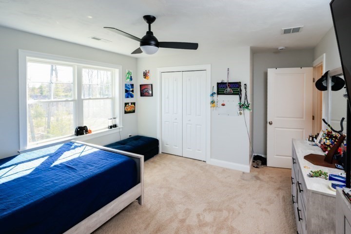 31 Lilac Avenue Bellingham, MA 02019 - Photo 30 of 40 a bedroom with a bed closet and a window