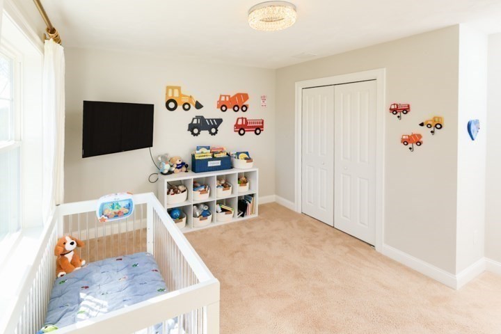 31 Lilac Avenue Bellingham, MA 02019 - Photo 31 of 40 a room with furniture and a flat screen tv