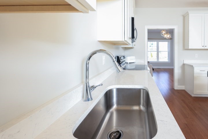 31 Lilac Avenue Bellingham, MA 02019 - Photo 5 of 40 a view of a kitchen with a sink and cabinets