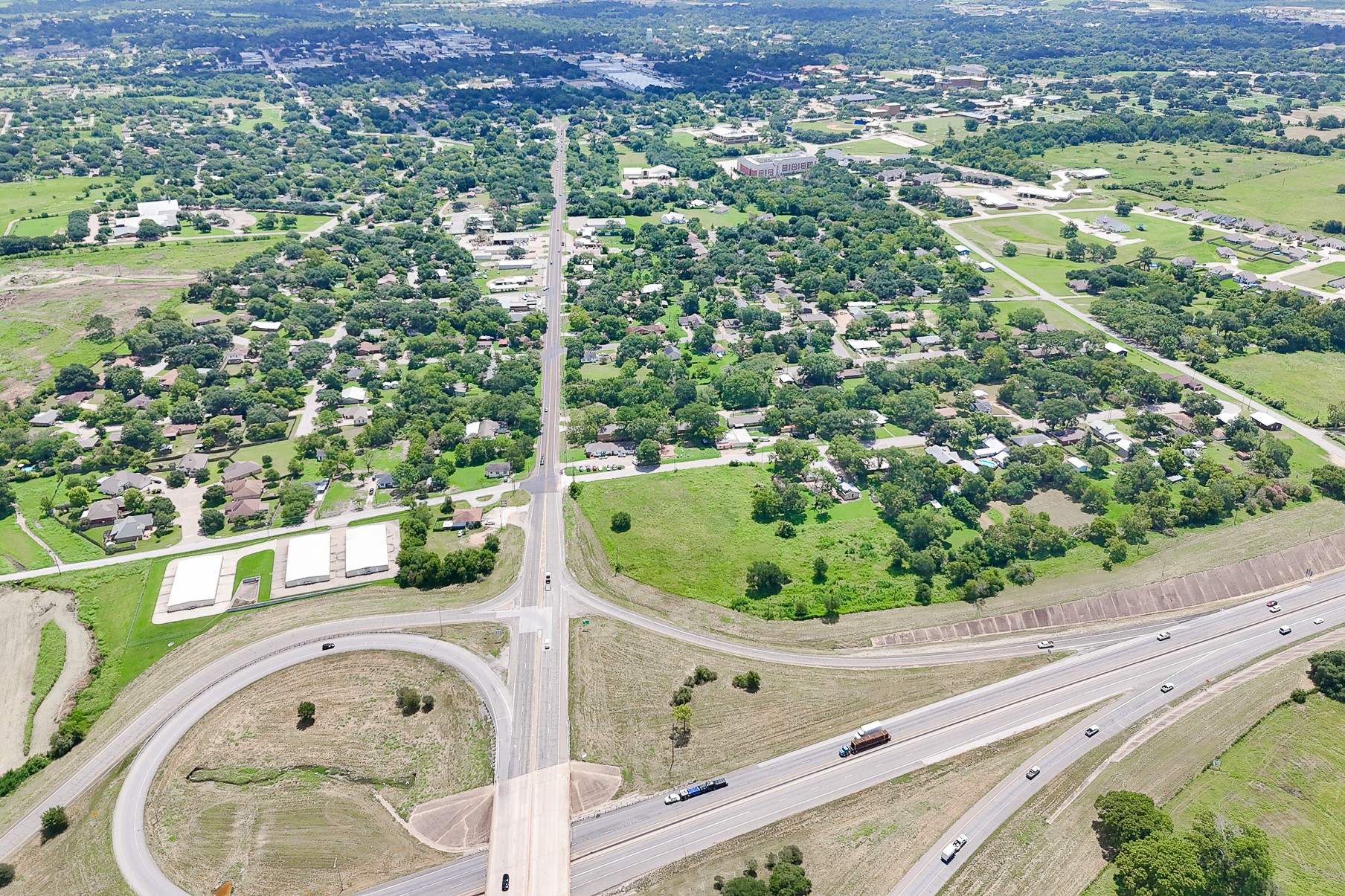 102 South Dixie Street Brenham, TX 77833 - Photo 17 of 40 an aerial view of a house with a yard and lake view