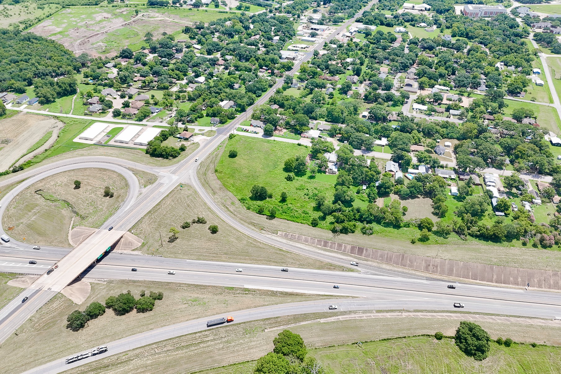102 South Dixie Street Brenham, TX 77833 - Photo 19 of 40 an aerial view of a house with a yard and garden