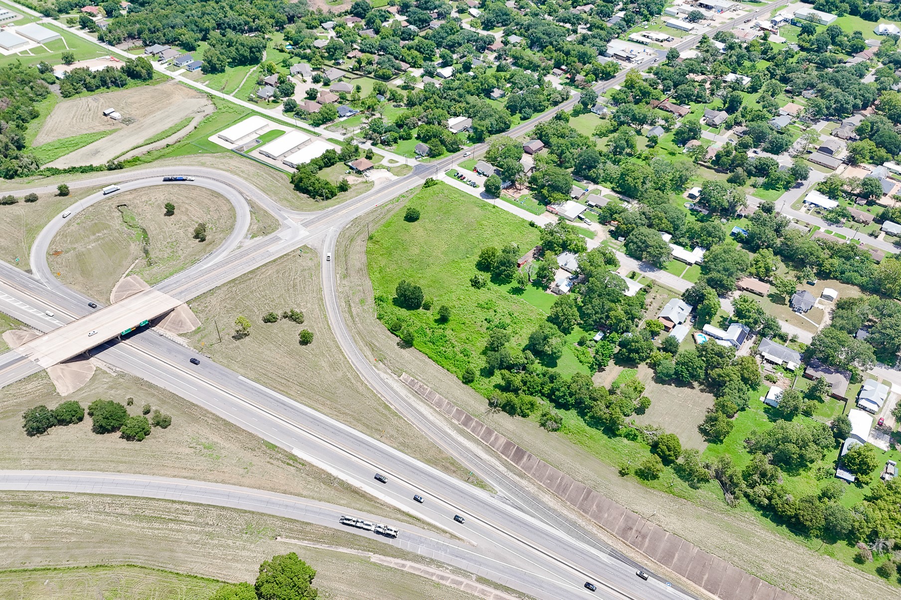 102 South Dixie Street Brenham, TX 77833 - Photo 20 of 40 an aerial view of a house with a yard and garden
