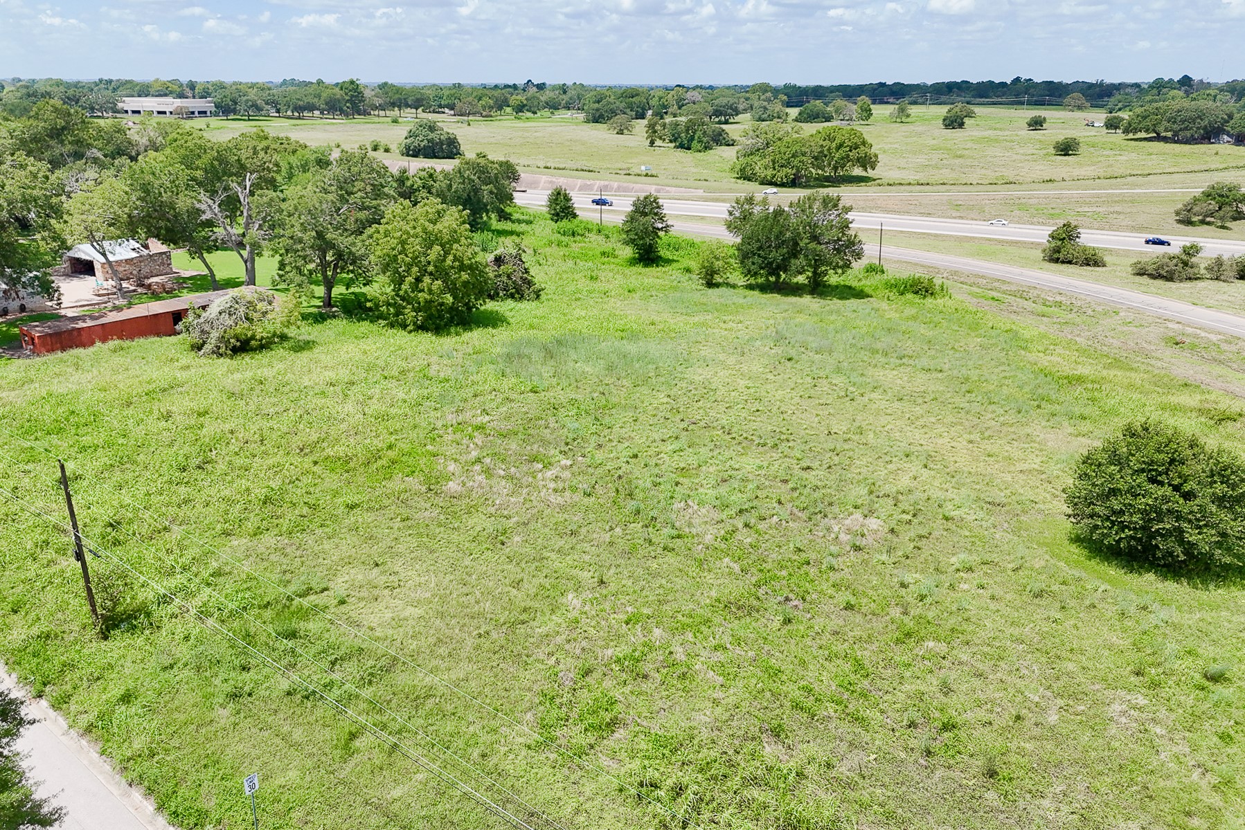 102 South Dixie Street Brenham, TX 77833 - Photo 36 of 40 a view of a lake with houses in the back