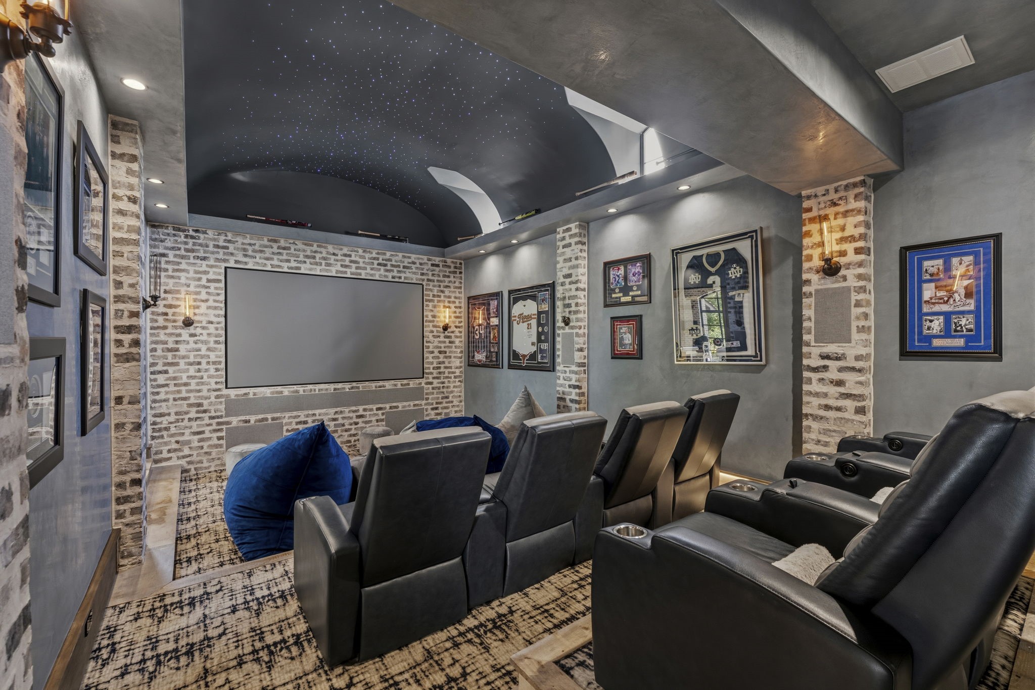 27006 Star Gazer Way Spring, TX 77386 - Photo 5 of 50 A private cinematic retreat featuring a lighted star ceiling, tiered step lighting, 120-inch projection screen, immersive surround sound, and a dedicated media rack.