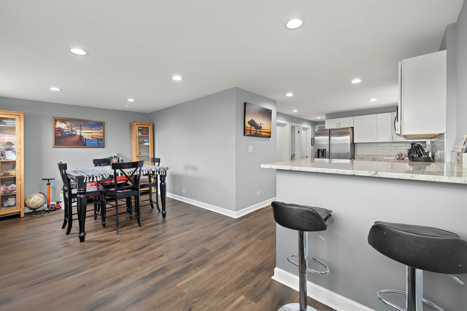 7535 West 61st Street Summit Argo, IL 60501 - Photo 11 of 28 a kitchen with stainless steel appliances granite countertop a dining table chairs and granite counter tops