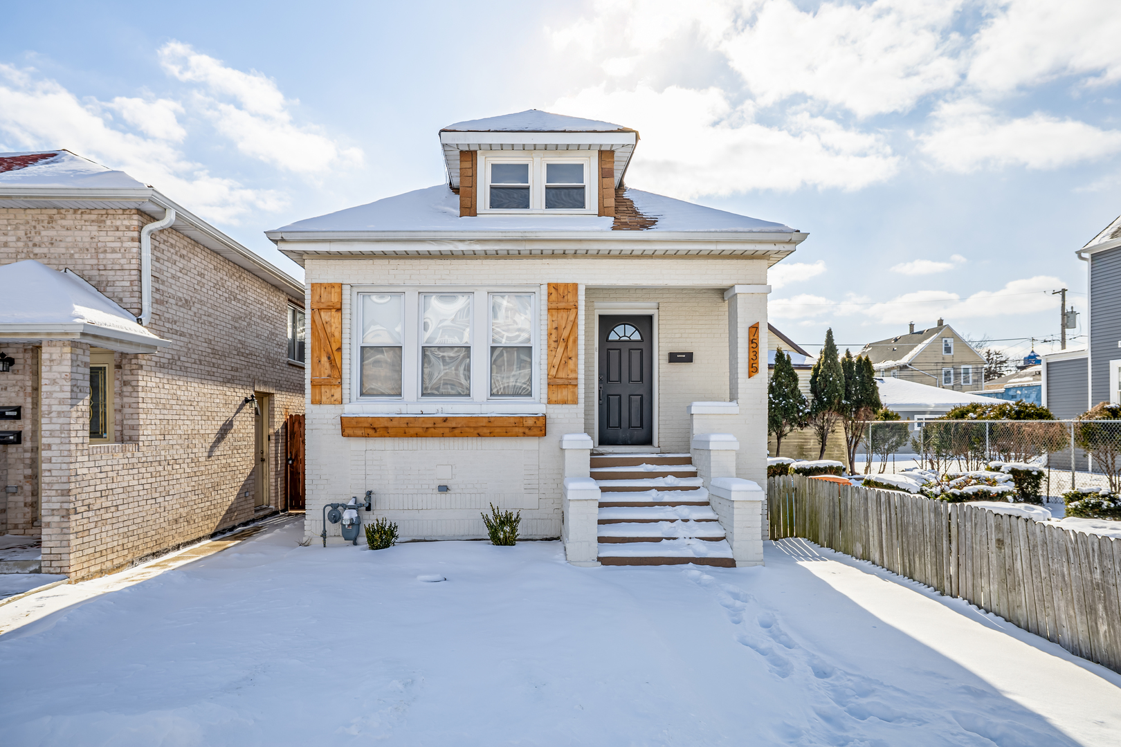 7535 West 61st Street Summit Argo, IL 60501 - Photo 2 of 28 a front view of a house with balcony