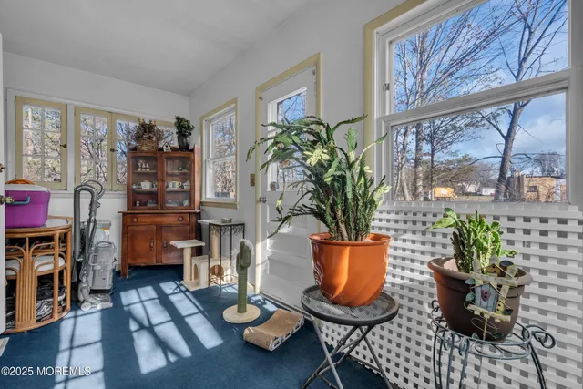 a very nice looking open kitchen with stainless steel appliances granite countertop a sink and cabinets