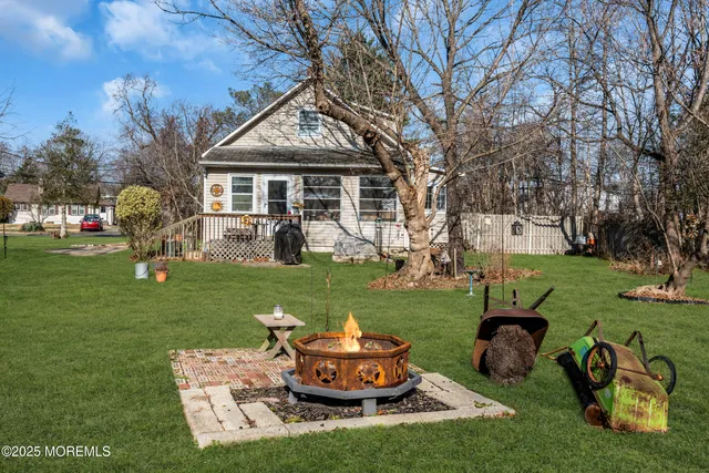 a view of a field of grass and trees