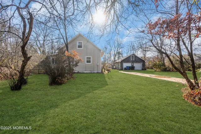 a front view of house with yard and green space