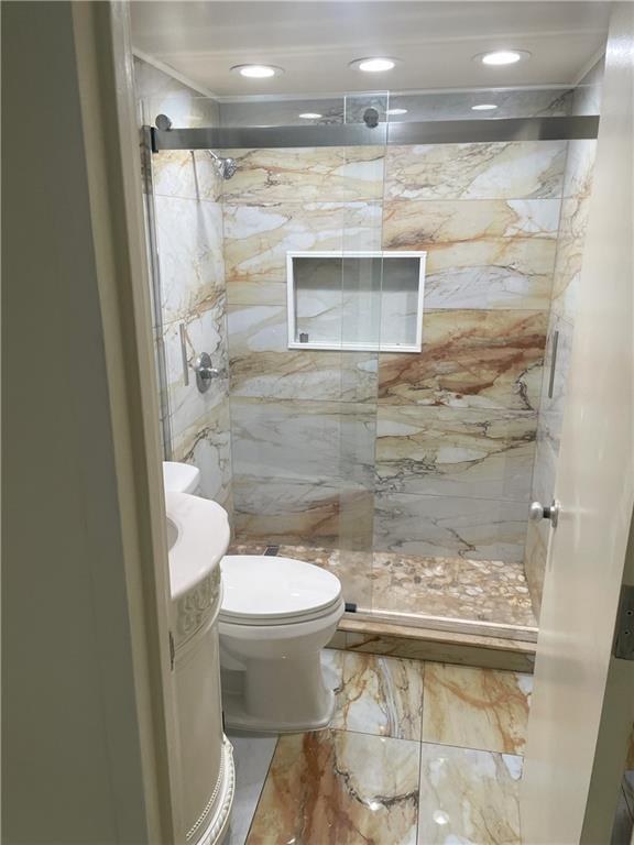 620 Peachtree Street Northeast, Unit 901 Atlanta, GA 30308 - Photo 19 of 19 a bathroom with a toilet and a shower