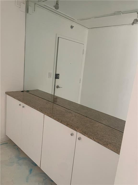 620 Peachtree Street Northeast, Unit 901 Atlanta, GA 30308 - Photo 9 of 19 a utility room with cabinets