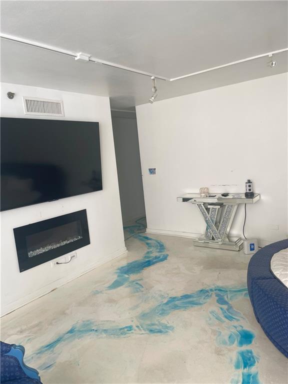 620 Peachtree Street Northeast, Unit 901 Atlanta, GA 30308 - Photo 10 of 19 a living room with furniture and a flat screen tv