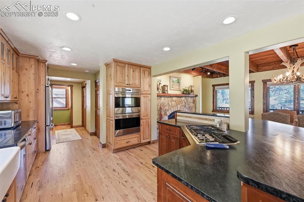 89 Ranch View Road Florissant, CO 80816 - Photo 19 of 50 This elegant kitchen hosts a dual ovens, and a propane gas range among other upgraded appliances.