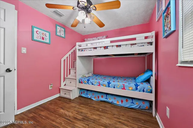 a view of an entryway with a chandelier fan