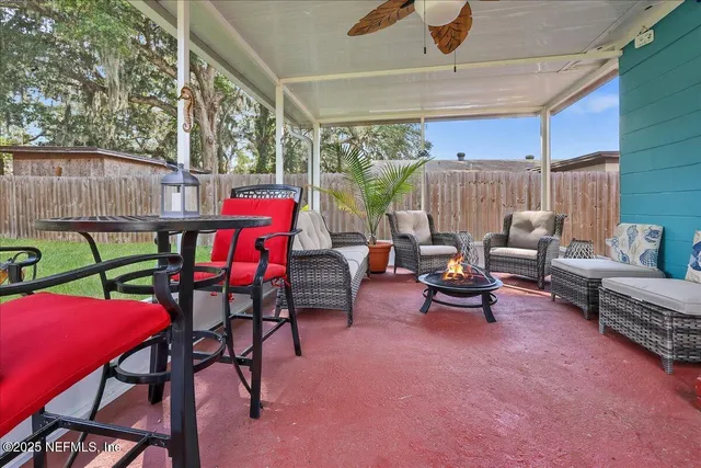 a patio with patio a couch and chairs