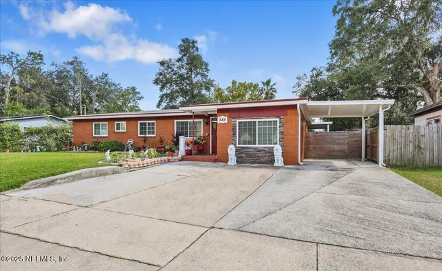 front view of a house with a yard
