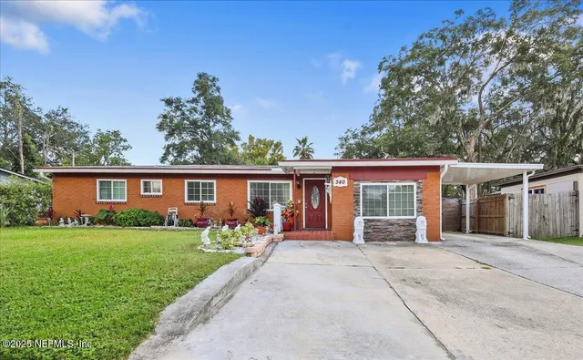 front view of a house with a yard