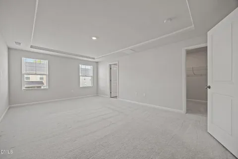 a view of an empty room with windows