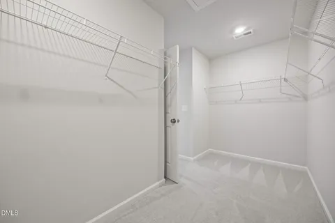 a view of a room with racks on the wall