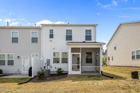 a view of a house with swimming pool in front of it