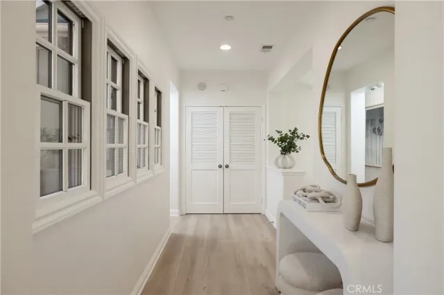 a view of a livingroom with furniture and entryway