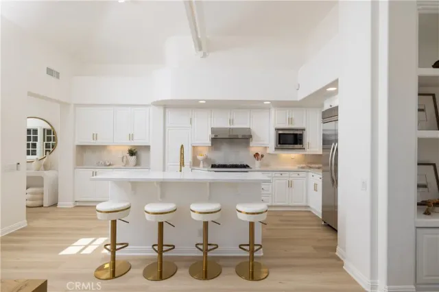 a kitchen with counter top space and appliances