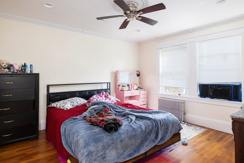 99 Franklin Street Lynn, MA 01902 - Photo 11 of 11 a bedroom with a bed and a tv on the dresser