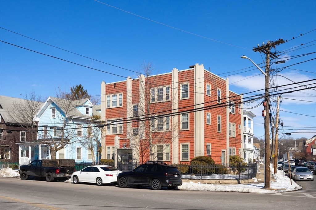 99 Franklin Street Lynn, MA 01902 - Photo 3 of 11 a city street lined with buildings and cars