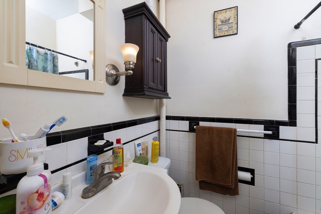 99 Franklin Street Lynn, MA 01902 - Photo 6 of 11 a bathroom with a sink and a mirror