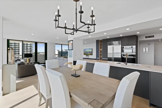 a view of a dining room with furniture wooden floor and chandelier