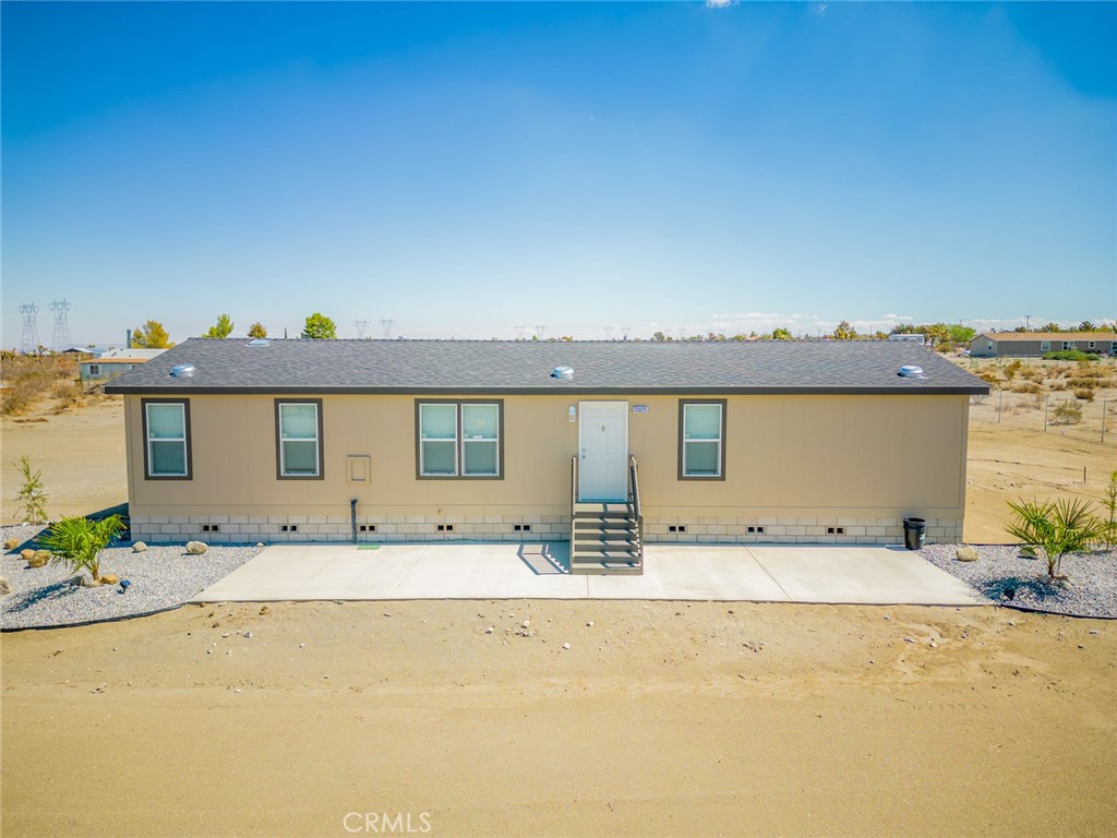 13025 Azure View Road Pinon Hills, CA 92372 - Photo 1 of 1 a view of a house with a swimming pool and a yard