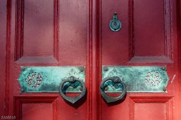 a front view of a house with yard and green space