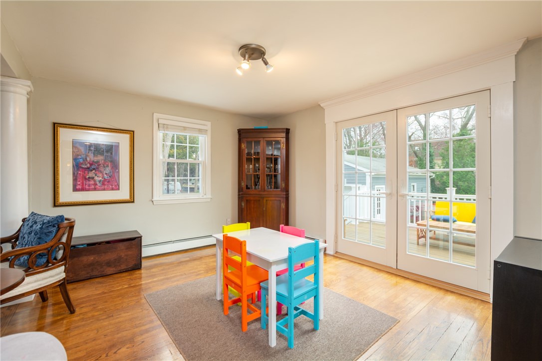 8 Curtis Road Bristol, RI 02809 - Photo 29 of 50 Living room area with access to the back deck can also function as a play area, dining area, or even home office space.