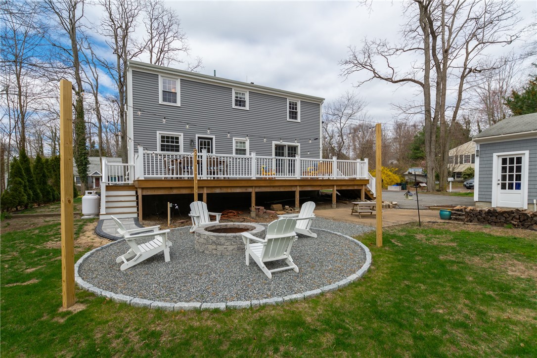 8 Curtis Road Bristol, RI 02809 - Photo 9 of 50 Back deck runs the entire length of the house and has access from the kitchen and the living room.