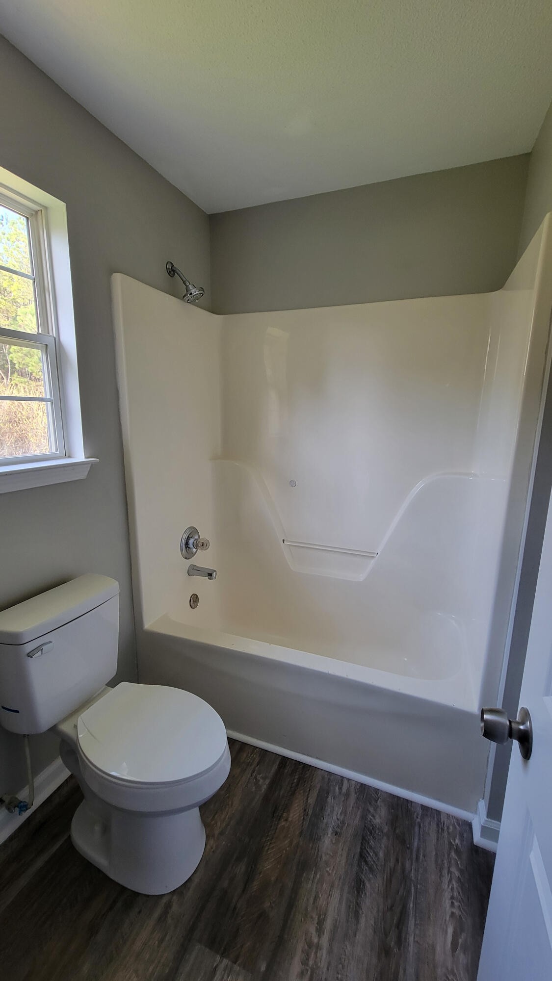 440 Samples Chapel Road Southeast Cleveland, TN 37323 - Photo 9 of 31 a white toilet sitting next to a bath tub