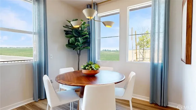 a dining room with furniture and window