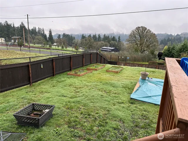 a view of a backyard with sitting area