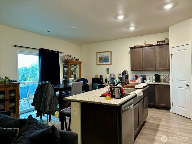a kitchen with a sink cabinets and appliances