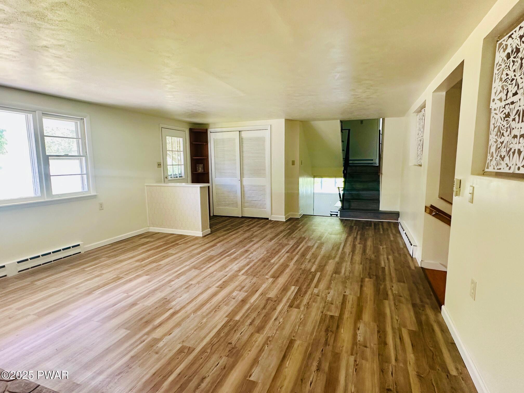 191 Hemlock Grove Road Greentown, PA 18426 - Photo 9 of 31 wooden floor in an empty room with a window