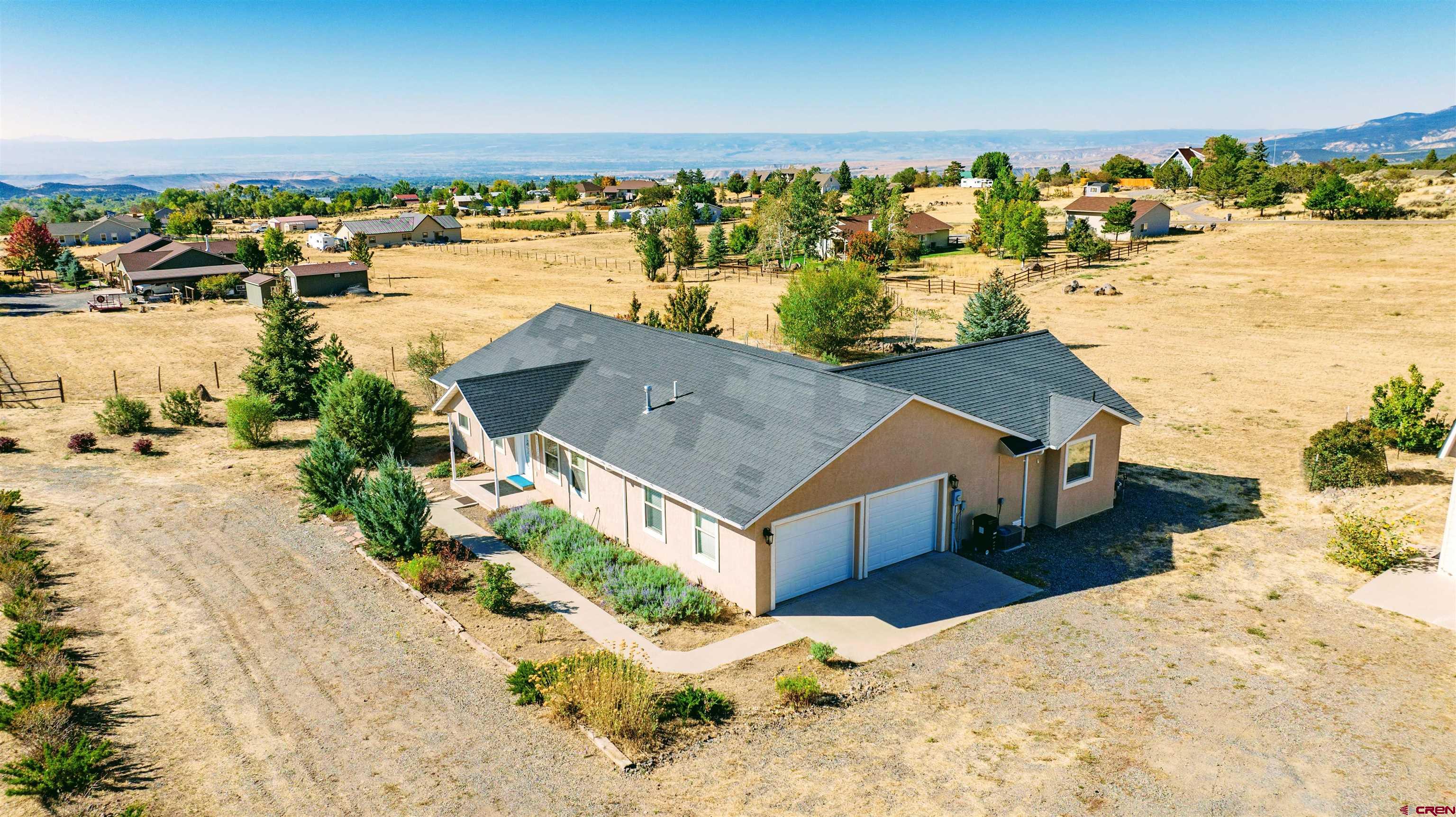 18641 2375th Road Cedaredge, CO 81413 - Photo 1 of 35 a view of a house with a ocean view