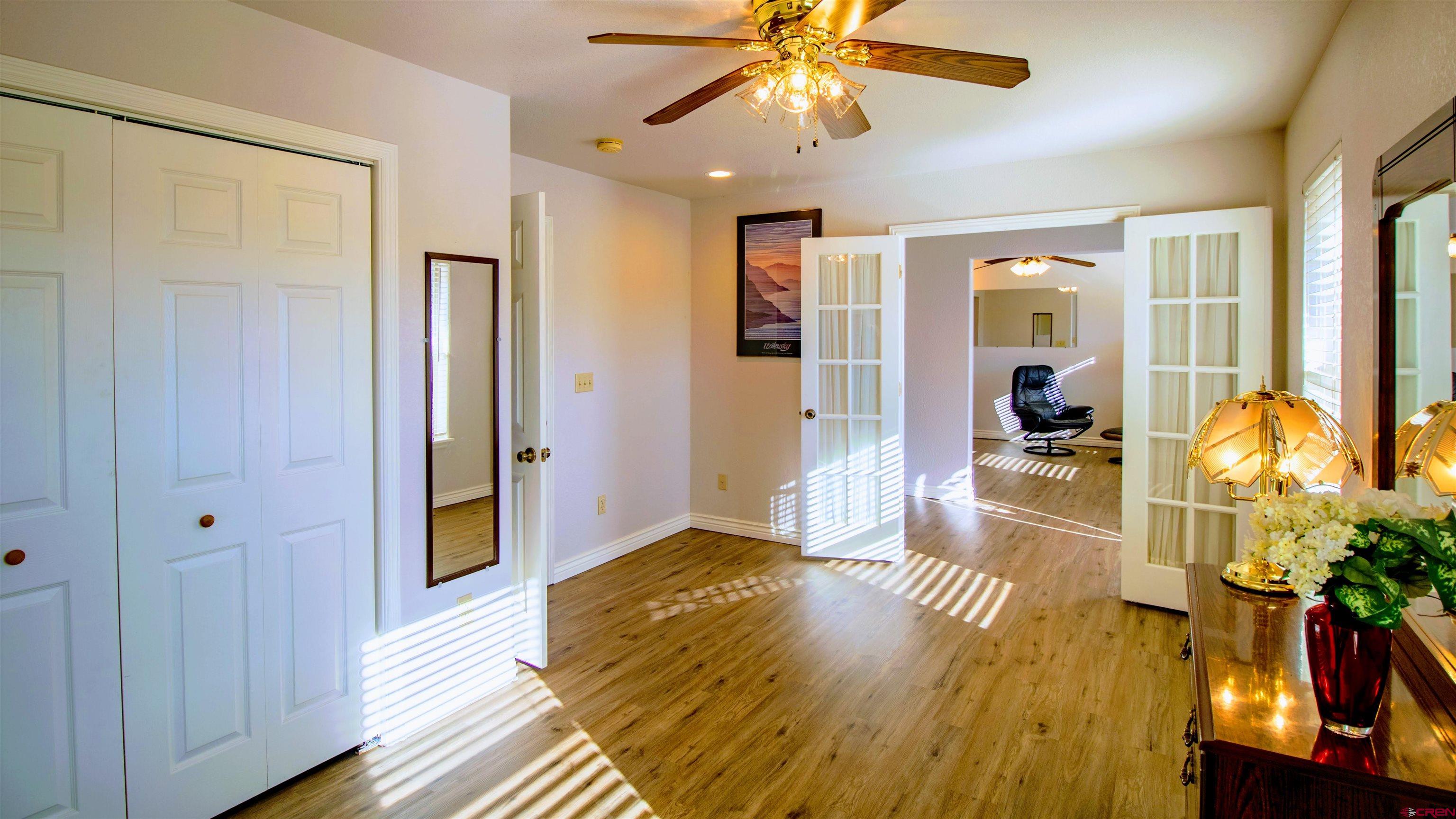 18641 2375th Road Cedaredge, CO 81413 - Photo 12 of 35 a living room with furniture and a chandelier