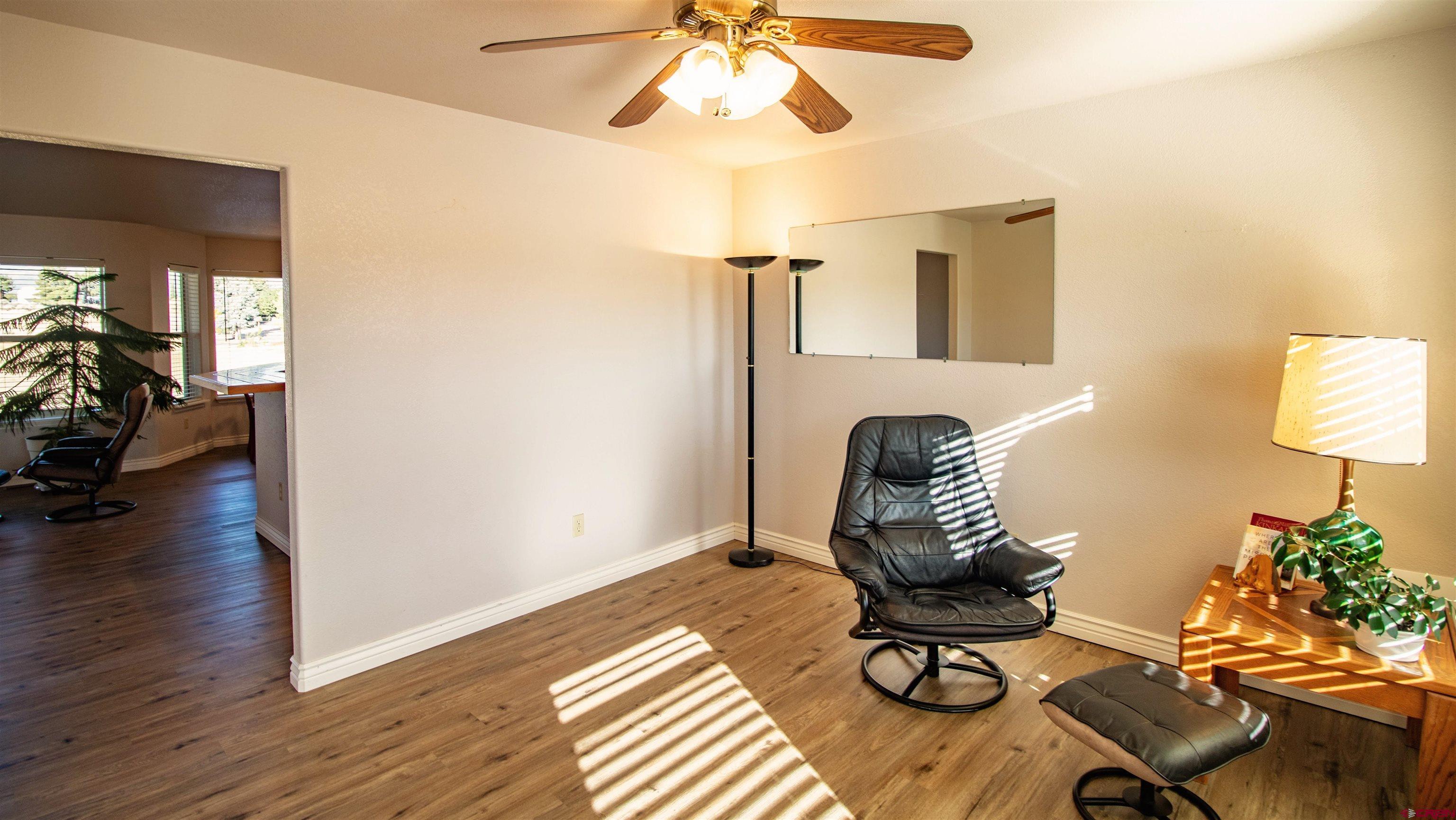 18641 2375th Road Cedaredge, CO 81413 - Photo 14 of 35 a view of entryway and livingroom with wooden floor
