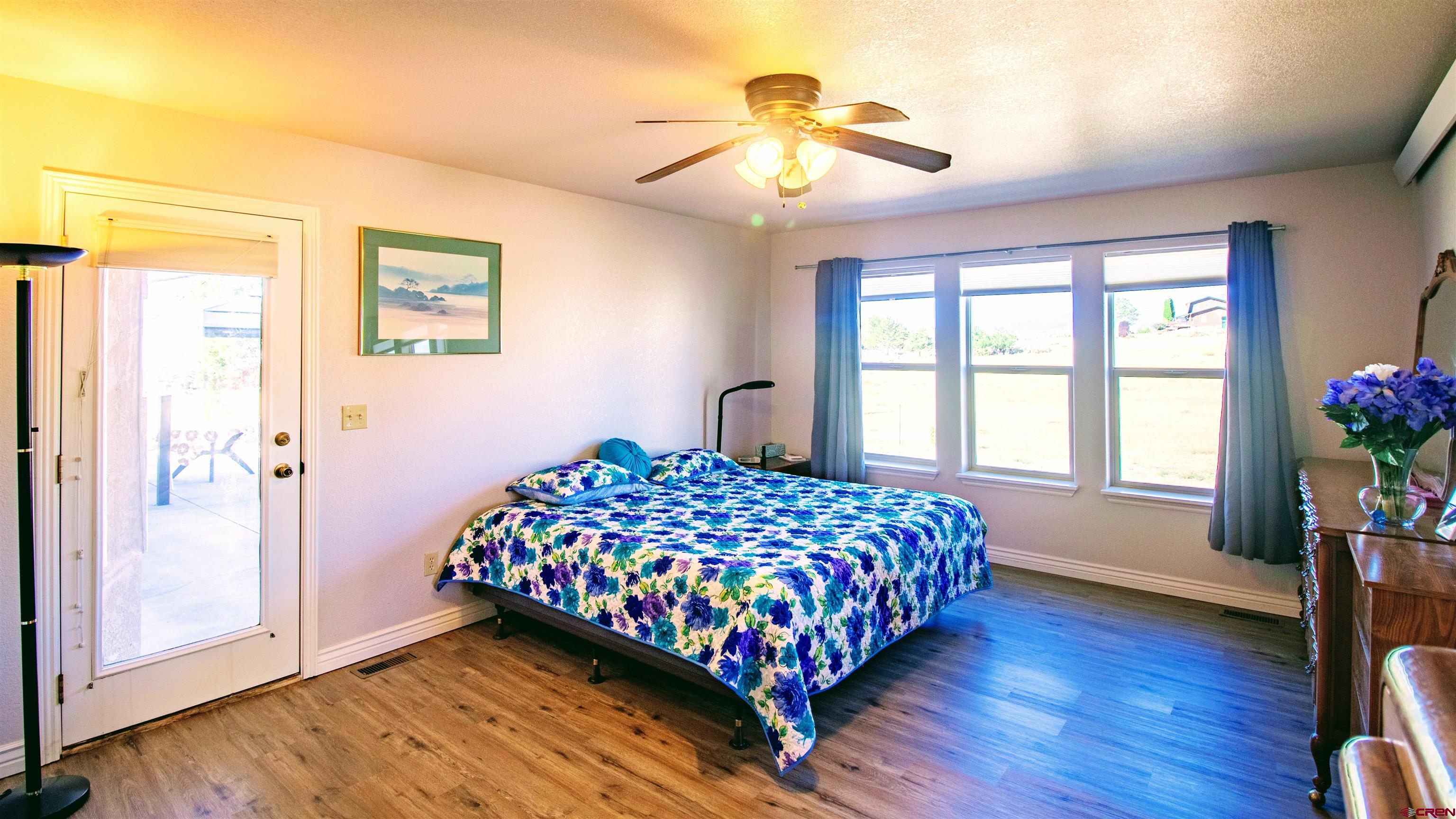 18641 2375th Road Cedaredge, CO 81413 - Photo 19 of 35 a bedroom with a bed and a window
