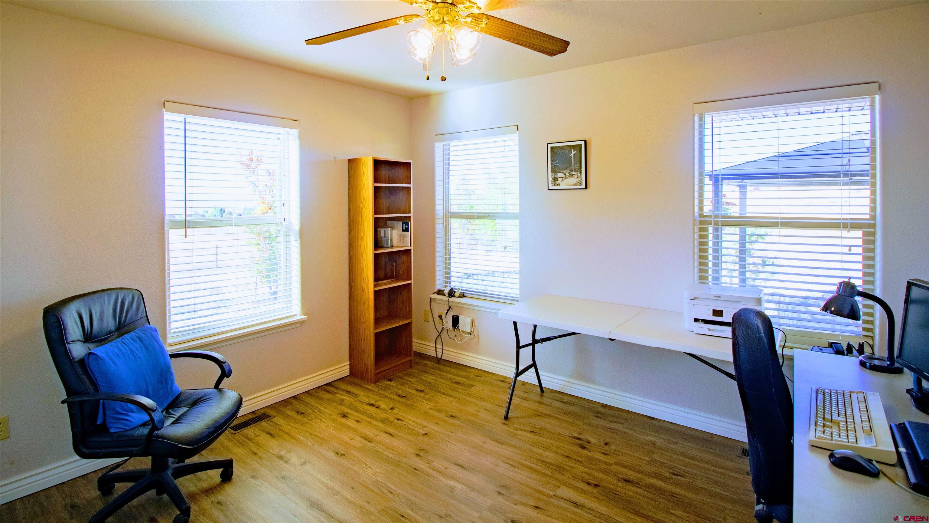18641 2375th Road Cedaredge, CO 81413 - Photo 20 of 35 a living room with furniture and a window