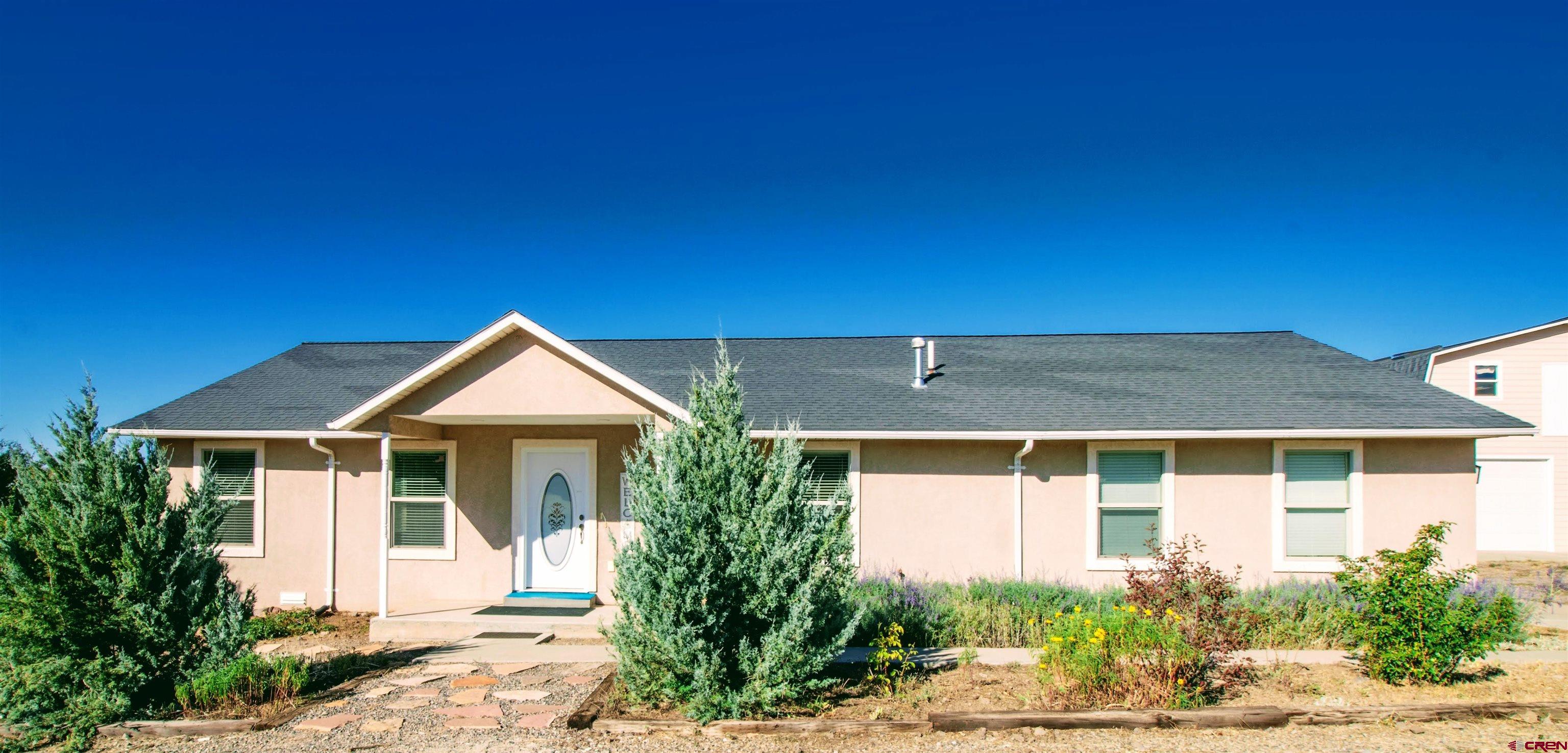 18641 2375th Road Cedaredge, CO 81413 - Photo 2 of 35 a front view of a house with a yard