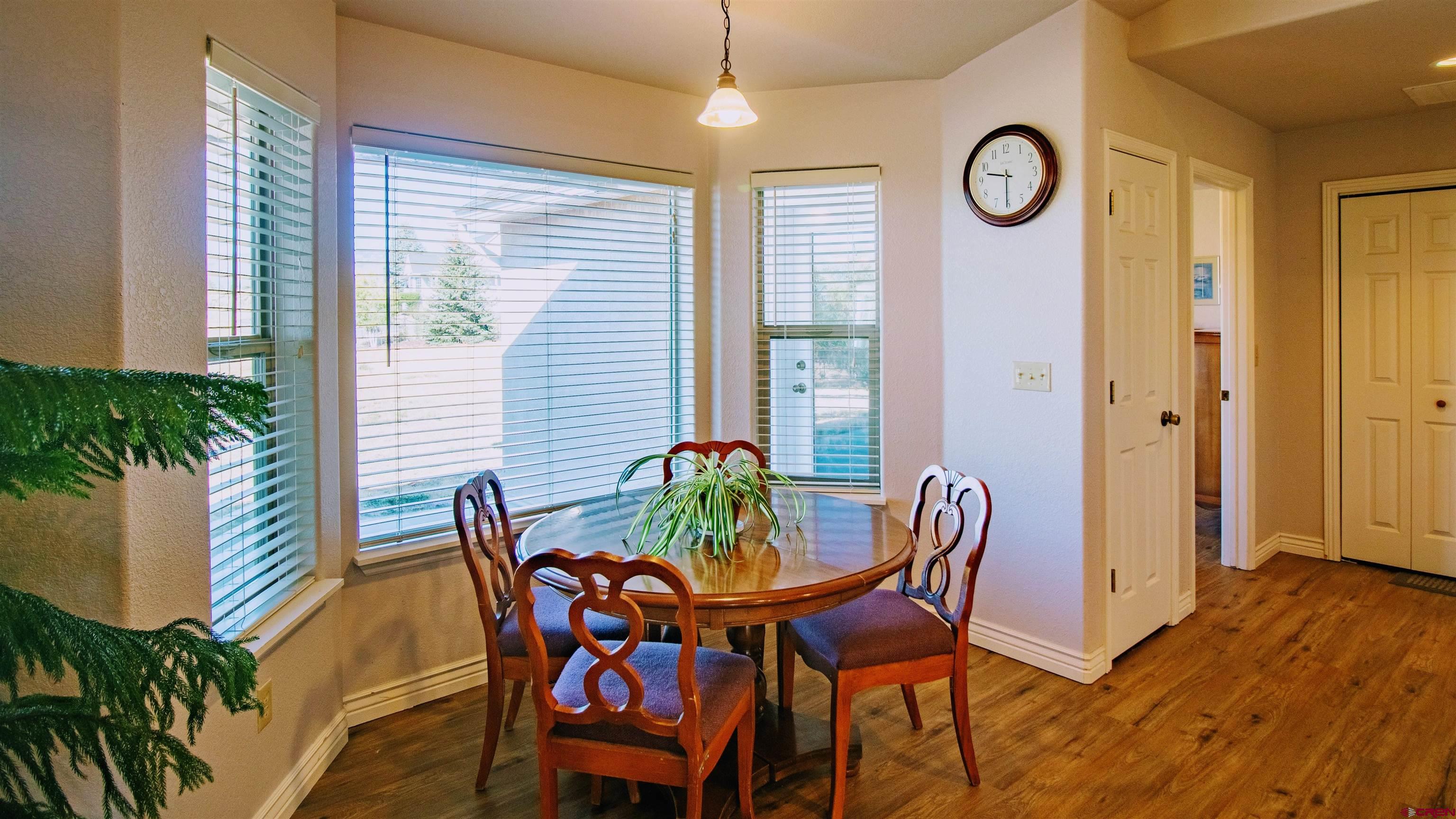 18641 2375th Road Cedaredge, CO 81413 - Photo 23 of 35 a view of a dining room with furniture and wooden floor