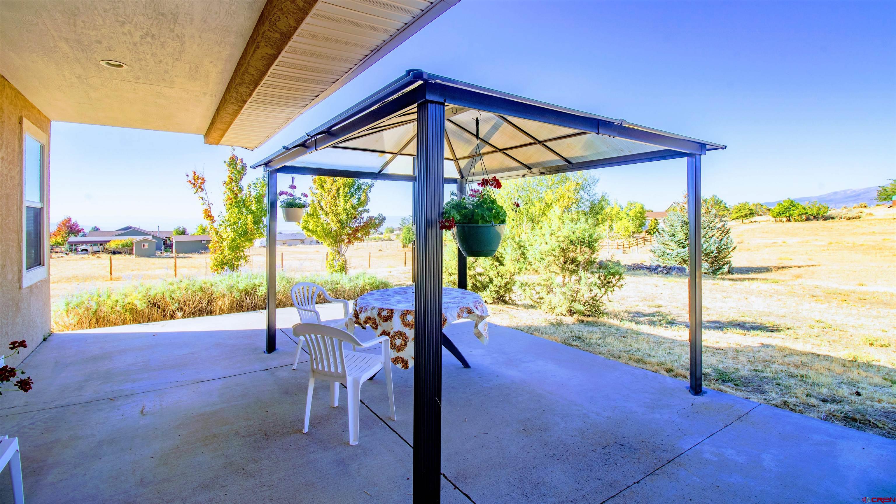 18641 2375th Road Cedaredge, CO 81413 - Photo 25 of 35 a view of porch with a flat tv screen and a floor to ceiling window