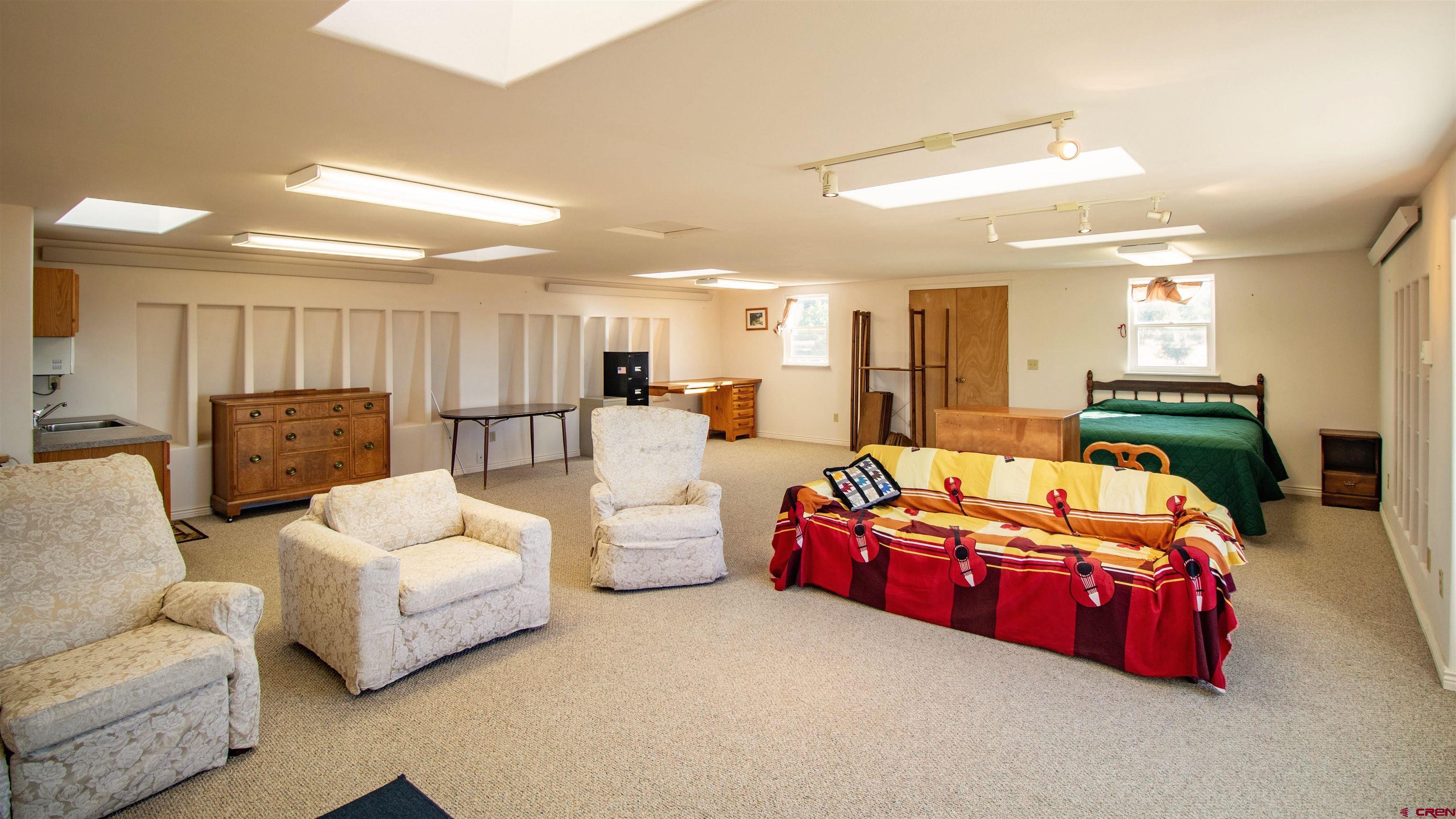 18641 2375th Road Cedaredge, CO 81413 - Photo 28 of 35 a living room with furniture and a flat screen tv